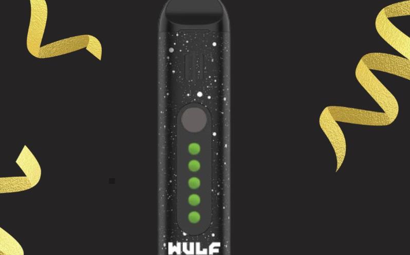 Wulf Flora dry herb vaporizer in black with LED indicators, advertised by De Soto Smoke Shop with store address and contact details displayed.
